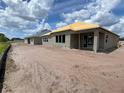 New construction home featuring block construction with covered lanai in a sunny landscape at 2703 Ravencliffe Ter, Oviedo, FL 32765
