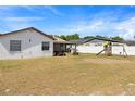 Expansive backyard featuring a lawn and play equipment, perfect for outdoor activities at 3041 Dikewood Ct, Winter Park, FL 32792