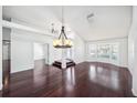 Spacious living room with beautiful hardwood floors and neutral walls, offering a clean and modern look at 308 Pine Shadow Ln, Lake Mary, FL 32746