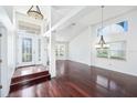 Bright living room with hardwood floors, a grand entrance door and ample natural light at 308 Pine Shadow Ln, Lake Mary, FL 32746
