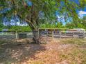 Rustic barn with wooden fencing, providing ample space for livestock and outdoor activities on the property at 38241 County Road 439, Eustis, FL 32736