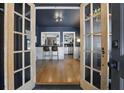 Stylish dining area features hardwood floors, bar seating, and modern lighting at 418 W Princeton St, Orlando, FL 32804