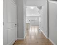 Spacious hallway features tile flooring and neutral paint, leading to the living areas at 5118 Adelaide Dr, Kissimmee, FL 34746