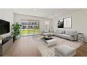 Bright living room with a large sliding glass door, a comfortable sofa, and stylish décor at 555 Southern Edge Way, Sanford, FL 32771