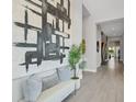 Bright foyer with soaring ceilings, modern art, and a view of the staircase at 7905 Jacks Club Dr, Kissimmee, FL 34747