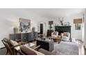 Cozy living room featuring dark hardwood floors, black accents, and an archway entryway at 906 Alhambra Ct, Orlando, FL 32804
