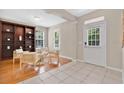 Bright living room with hardwood floors, built-in bookshelf, and natural light at 1131 Indigo Dr, Kissimmee, FL 34747