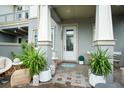 Front porch with seating area, plants and lovely front door at 13437 Granger Ave, Orlando, FL 32827