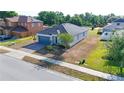 Beautiful single-story home with a brick driveway and well-maintained landscaping at 1405 Osprey Ridge Dr, Eustis, FL 32736