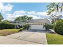 Charming single story home with an attached two-car garage and well-manicured front yard at 2260 Winslow Cir, Casselberry, FL 32707