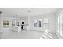 Bright and spacious open concept with kitchen island and recessed lighting at 2378 Addalia Aly, Orlando, FL 32804