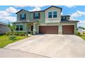 Attractive two-story home with a spacious driveway and an attached two-car garage at 2995 Flying Blackbird Rd, Bartow, FL 33830