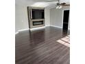 Spacious living room with wood flooring and modern fireplace at 37518 Quail Ridge Cir, Leesburg, FL 34788