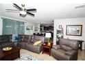 Comfortable living room with plush seating and an open floor plan at 4793 Grassy Knoll Dr, Tavares, FL 32778