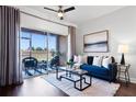 Comfortable living room with sliding glass doors to the patio, offering seamless indoor-outdoor living at 774 Chelsea Dr, Davenport, FL 33897