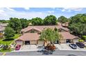 Exterior shot of the home featuring attached garages and beautiful landscaping at 7768 Sugar Bend Dr # 7768, Orlando, FL 32819