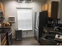 Contemporary kitchen with stainless steel appliances, sleek countertops, and ample storage at 8973 Lee Vista Blvd # 2308, Orlando, FL 32829