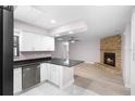 Modern kitchen with white cabinets, stainless steel appliances, and open layout at 10140 Bridlewood Ave, Orlando, FL 32825