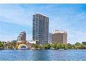 Exterior shot of the high-rise building on the lake with beautiful blue skies at 150 E Robinson St # 2807, Orlando, FL 32801