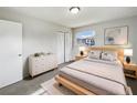 Bright bedroom featuring a plush rug, a wooden bed frame and modern decor and finishes at 1543 Sarah St, Lake Wales, FL 33898