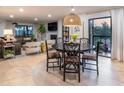 Stylish dining area showcasing modern furnishings, hardwood floors, and open floor plan at 200 Carolina Ave # 201, Winter Park, FL 32789
