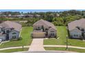 Lovely two-story home on a large lot with lush green grass and an attached garage at 2655 Star Lake View Dr, Kissimmee, FL 34747