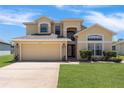 Beautiful two-story home with a well-kept lawn and attached two-car garage at 2655 Star Lake View Dr, Kissimmee, FL 34747