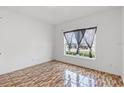 Bedroom featuring patterned tile floors and a sunny window with curtains at 3345 Reedy Glen Dr, Kissimmee, FL 34758