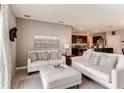 Comfortable living room with neutral furniture and an open layout to the kitchen at 3617 Fort Mellon Ln, Sanford, FL 32773