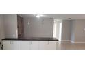 Bright living space showcasing a breakfast bar with pendant lighting and an open floor plan at 7028 Clarcona Ocoee Rd., Orlando, FL 32818