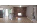 Open-concept living space with brick fireplace and sliding doors to the outdoor area at 7028 Clarcona Ocoee Rd., Orlando, FL 32818