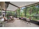 Relaxing screened-in porch, perfect for enjoying the outdoors, with comfortable seating and serene views at 903 Oak Leaf Ct, Altamonte Springs, FL 32714