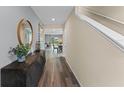 Inviting foyer boasts hard wood floors and staircase leading to the second floor at 984 Commons Way, Port Orange, FL 32129