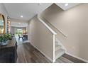 Inviting foyer boasts hard wood floors and staircase leading to the second floor at 984 Commons Way, Port Orange, FL 32129
