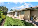 Inviting home entrance featuring a white door, brick pathway, and well-maintained lawn, creating a welcoming first impression at 11908 Delfina Ln, Orlando, FL 32827
