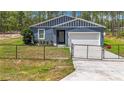 Home exterior with black chain link fence, gate, and well-kept lawn with a 'Beware of Dog' sign at 13297 Sw 69Th Pl, Ocala, FL 34481