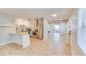 Bright, open kitchen featuring stainless steel appliances and a granite countertop breakfast bar at 1809 Pineview Cir, Winter Park, FL 32792
