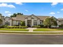Charming stucco home with well-maintained landscaping and tile roof at 240 Promenade Cir, Lake Mary, FL 32746