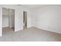 Clean bedroom with neutral carpet, a closet, an ensuite bathroom, and ample natural light at 445 Cottonwood Dr, Altamonte Springs, FL 32714