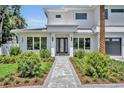 Charming home exterior showing brick pathway, front door, and well-kept landscaping at 731 Williams Dr, Winter Park, FL 32789