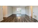 Spacious living room with modern wood-look flooring and natural light at 1108 Jordan Ave, Orlando, FL 32809