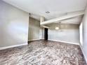 Spacious living room featuring high ceilings, ceiling beams, tile floors, and neutral paint at 128 Brushcreek Dr, Sanford, FL 32771