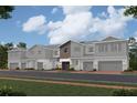 Charming row of modern townhouses with gray siding, stone accents, and attached garages at 14938 Harvest St, Orlando, FL 32824