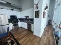 An updated kitchen featuring stainless steel appliances and ample cabinet space at 150 E Robinson St # 717, Orlando, FL 32801