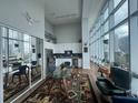 Open concept living and dining area with gorgeous city views from floor to ceiling windows at 150 E Robinson St # 717, Orlando, FL 32801