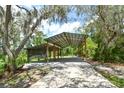 Spacious outdoor pavilion perfect for gatherings or covered storage on the property at 15305 Shady Ln, Tavares, FL 32778