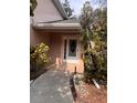 Inviting front entrance with a walkway leading to the front door of the home at 1621 Emily Ct, Kissimmee, FL 34744