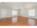Spacious living room features wood floors, ceiling fan and natural light at 1653 Turtle Rock Dr, Lakeland, FL 33803