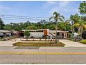 Mid-century home featuring a concrete fence, stucco walls, and orange trim at 2303 Bonneville Dr, Orlando, FL 32826