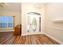 Entryway with decorative front door and hardwood-style floors at 3441 Hickory Creek Rd, Deltona, FL 32738